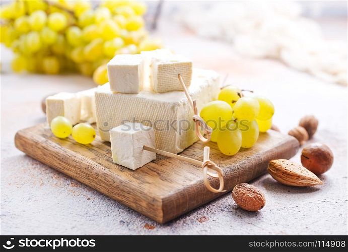 wine and cheese on a table, stock photo