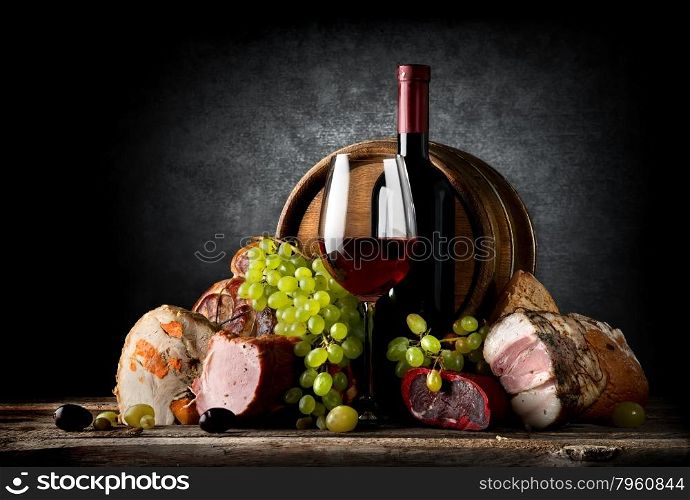 Wine and food on a black background
