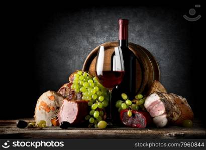 Wine and food on a black background