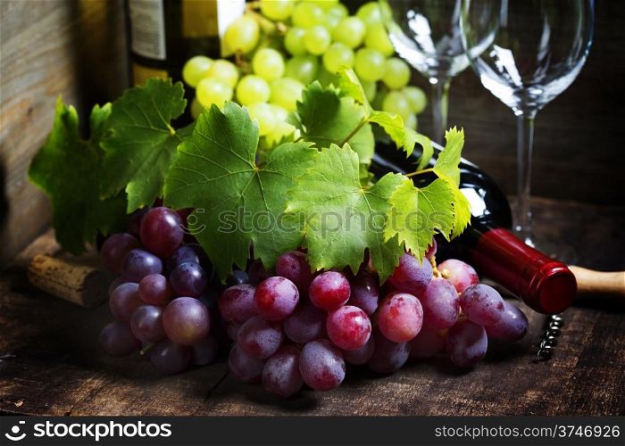 Wine and grape on wooden background