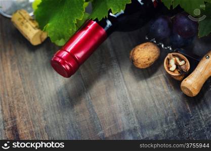 Wine and grape on wooden background