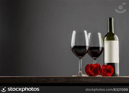 Wine and roses. Two glasses of red wine and heart shaped roses, Valentine day