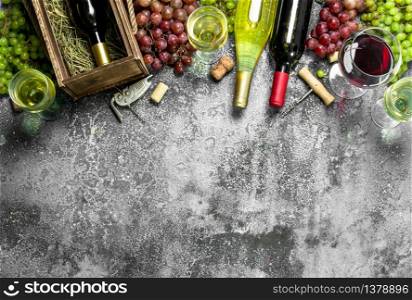 Wine background. Red and white wine from fresh grapes. On a rustic background.. Wine background. Red and white wine from fresh grapes.