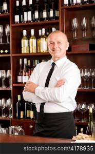 Wine bar waiter male in restaurant posing with cross arms