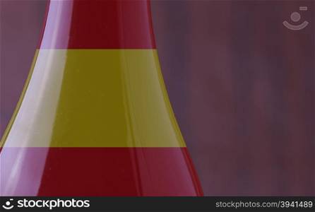 Wine bottle with Spain flag in strict close up, with copy space, horizontal image