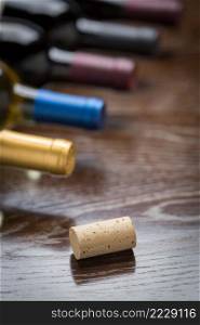 Wine Bottles and Cork on a Reflective Wood Surface Abstract.