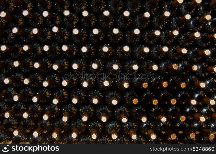 Wine bottles in a row as a pattern with cork in Mediterranean winery