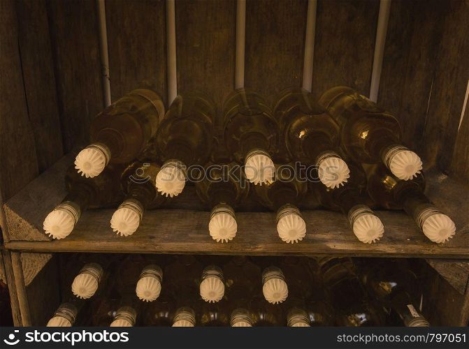 Wine bottles in wine crate, self brewed close-up vintage. Wine bottles in wine crate, self brewed close-up