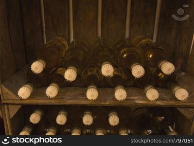 Wine bottles in wine crate, self brewed close-up vintage. Wine bottles in wine crate, self brewed close-up