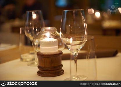 Wine bottles on a wooden shelf in modern restaurant interior