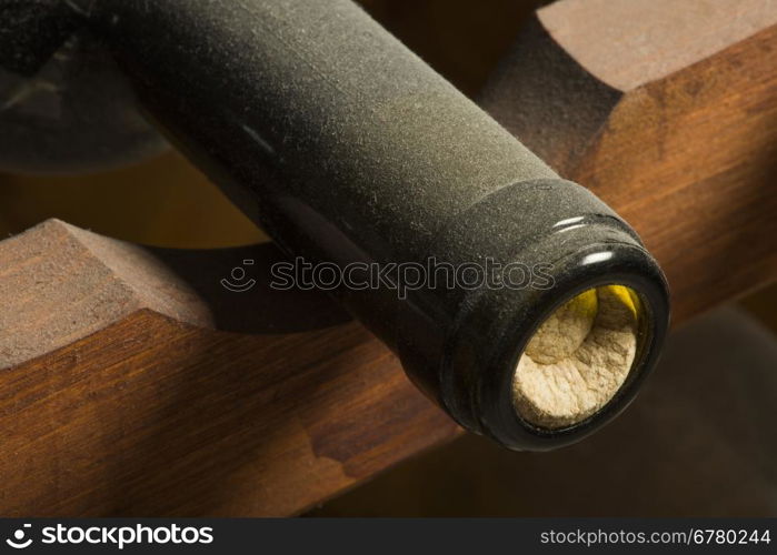 Wine bottles on shelf. Wine cellar. Close up wine bottles.