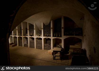 wine cellar with old wine bottles