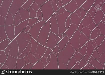 Wine colored wall with cracks, great for your design and texture background