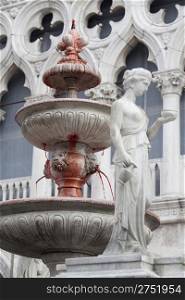Wine coming out from a fountain in San Marco square in Venice