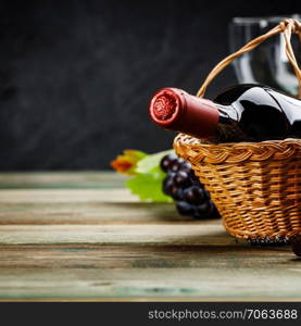 Wine composition on dark rustic background, space for text