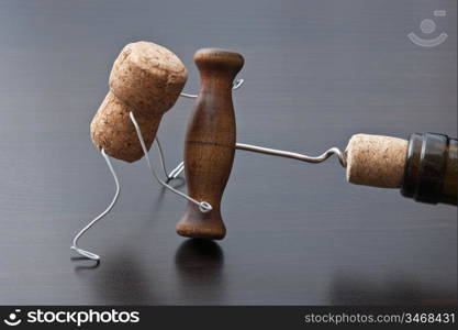 wine corks and bottle with corkscrew