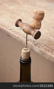 wine corks and bottle with the corkscrew