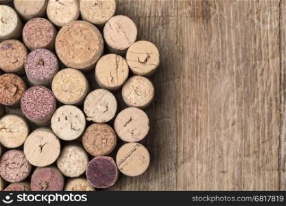 wine corks on wooden table bakground textute