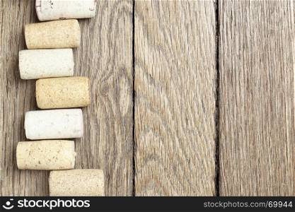 Wine corks over wooden surface with copyspace on the right