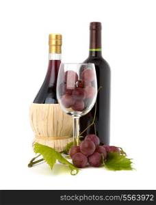 wine glass full with grapes and two wine bottles isolated on white background