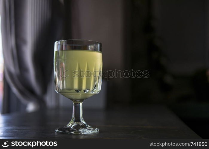 wine glass with lemonade in a summer cafe