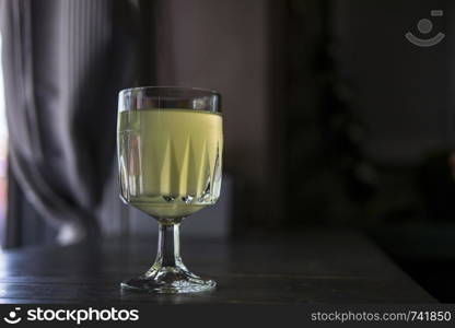 wine glass with lemonade in a summer cafe