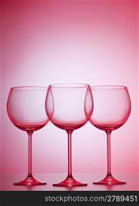 Wine glasses against gradient background