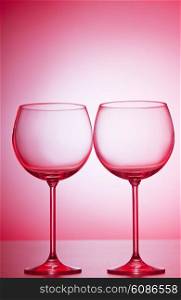 Wine glasses against gradient background