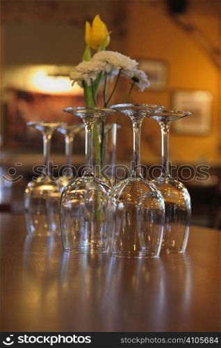 wine glasses placed upside down on table in restaurant