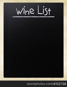 ""Wine list" handwritten with white chalk on a blackboard"