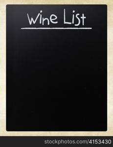 ""Wine list" handwritten with white chalk on a blackboard"