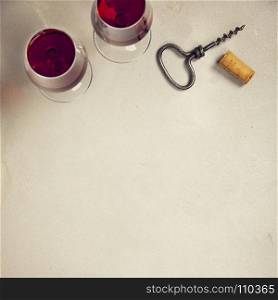 Wine over grey concrete background. Top view, copy space