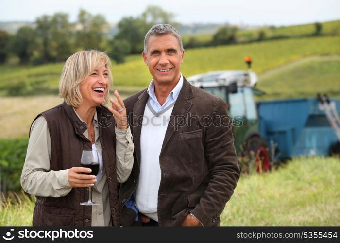 wine producers laughing in the vines