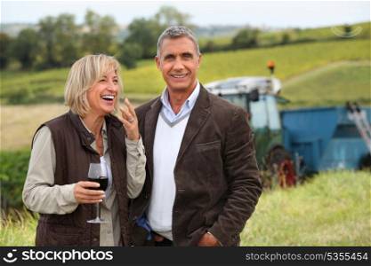 wine producers laughing in the vines