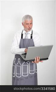 Wine waiter using laptop computer