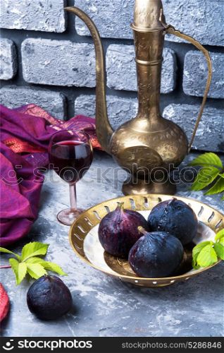wine with figs. glass with red wine prepared from the autumn fruits of figs