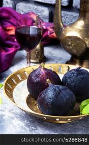 wine with figs. glass with red wine prepared from the autumn fruits of figs
