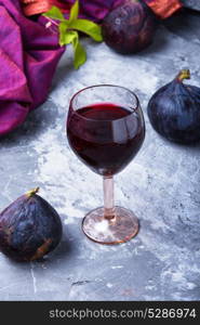 wine with figs. glass with red wine prepared from the autumn fruits of figs