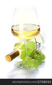 wineglass with white wine and grape over white