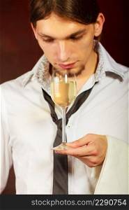 Winery alcohol liquor drinking concept. Somellier checking wine quality. Young male waiter holds wine glass. . Somellier checking wine quality.
