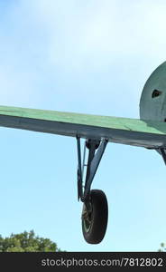 Wing and undercarriage of an old airplane, bottom view