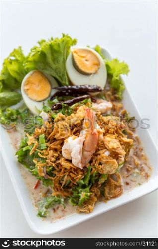 winged bean salad with shrimp and boiled egg on white background