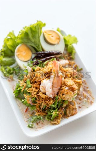 winged bean salad with shrimp and boiled egg on white background