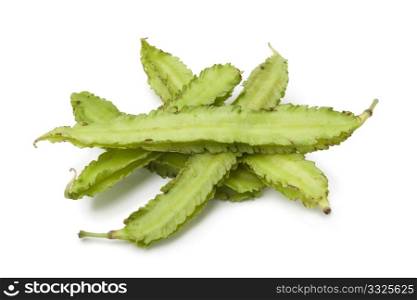 Winged beans on white background