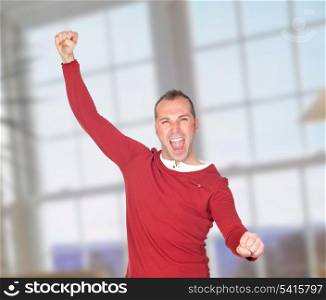 Winner man celebrating something with a window of background