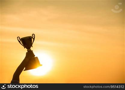Winner win holding golden ch&ion trophy cup prize. Silhouette best award victory trophy for professional ch&ion challenge team holding gold sport trophy cup over head. Win-Win sport team concept