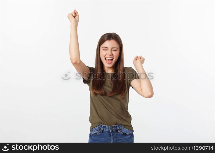 Winning success woman happy ecstatic celebrating being a winner. Dynamic energetic image of Caucasian female model isolated on white background.. Winning success woman happy ecstatic celebrating being a winner. Dynamic energetic image of Caucasian female model isolated on white background