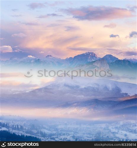 Winter Alpine mountains snowy landscape at sunrise