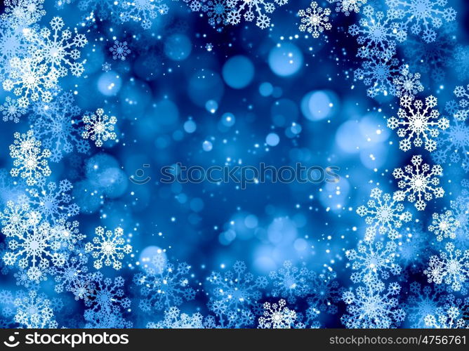 Winter background. Blue Christmas background with snowflakes and lights