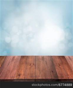 Winter bokeh background with wooden table